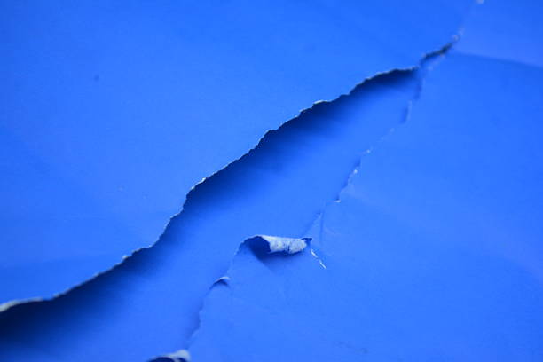 istock blue torn paper background texture 2238885623