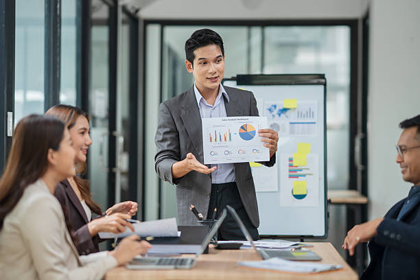 istock Businessman is standing and presenting his work in a conference room. 2238889535