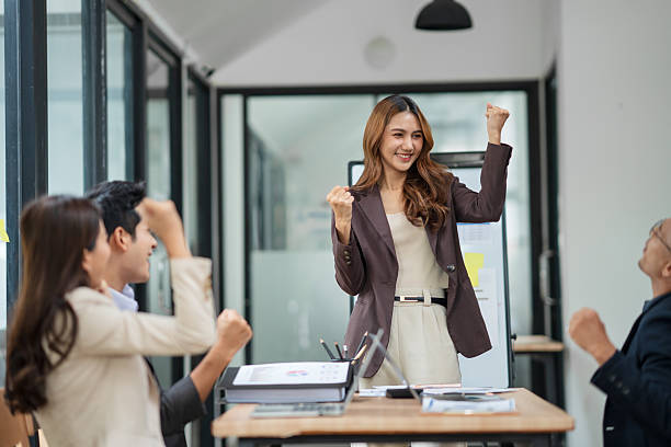 istock A businesswoman is standing in a conference room presenting her work. 2238889548