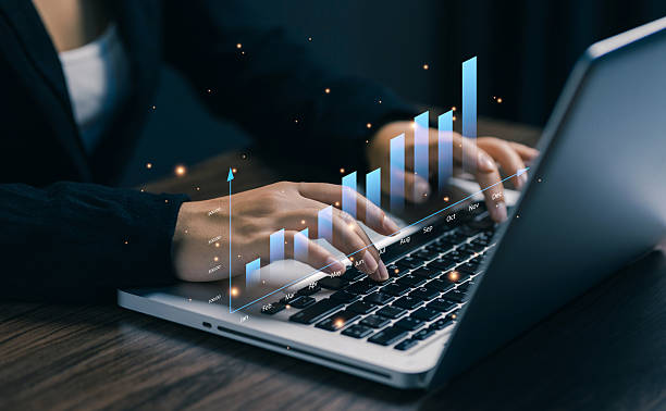 istock Hands typing on laptop with glowing bar graph rising upward, symbolizing financial growth, business performance, data analysis, and economic success in modern digital strategy. 2238897651