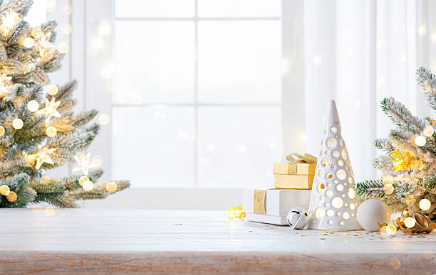 istock Gift boxes and Christmas tree decoration background with copy space on wooden table 2238898268