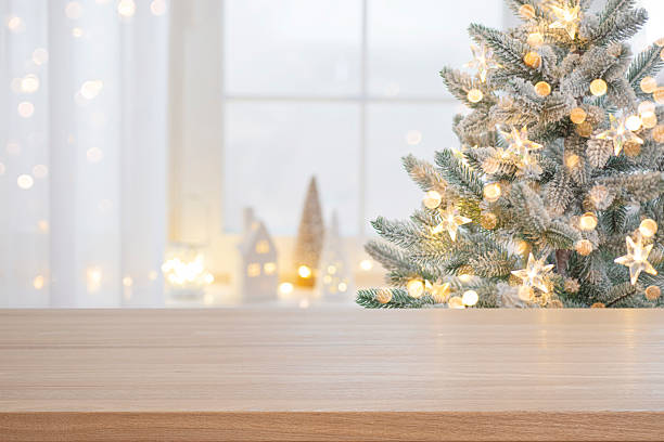 istock Christmas presentation empty wooden table top with blurred fir tree and illumination lights background 2238898274