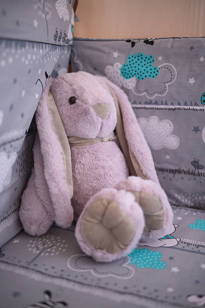 istock Fluffy Purple Bunny In Crib 2238900050