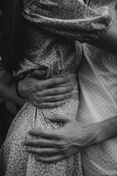 Lucky young couple goes for a walk by the river – pregnant wife with baby belly
