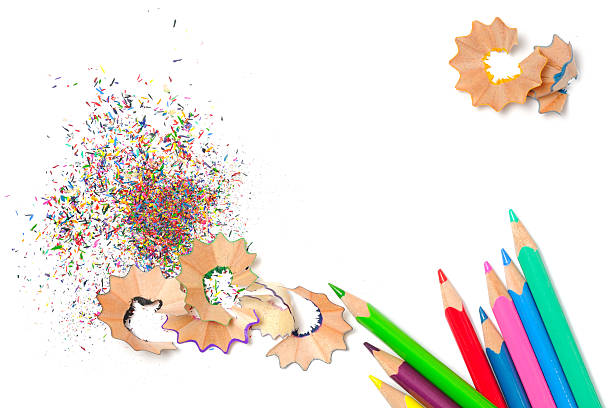 istock Colorful pencils with shavings and dust isolated on white 2238900620