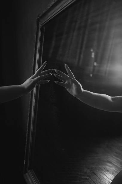 istock Dark mystery hands touching glass 2238900757