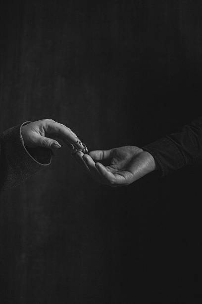istock Ring in hand dark moody portrait 2238901278
