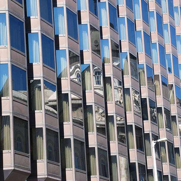 Modern building with sky and historic building reflexion