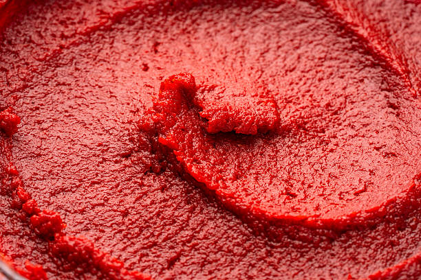 istock Close-up of tomato or pepper paste or puree 2238903221