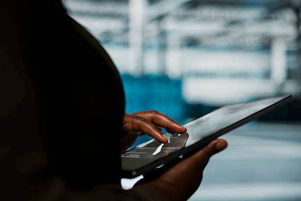 istock Close up of engineer using tablet in data center to track metrics 2238911274