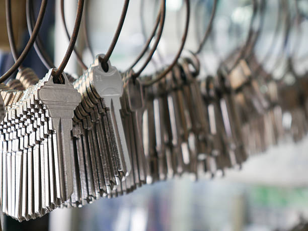 Multiple Duplicate Keys Hanging on Wire Rings at Locksmith Shop - Key Cutting and Duplication Service Business