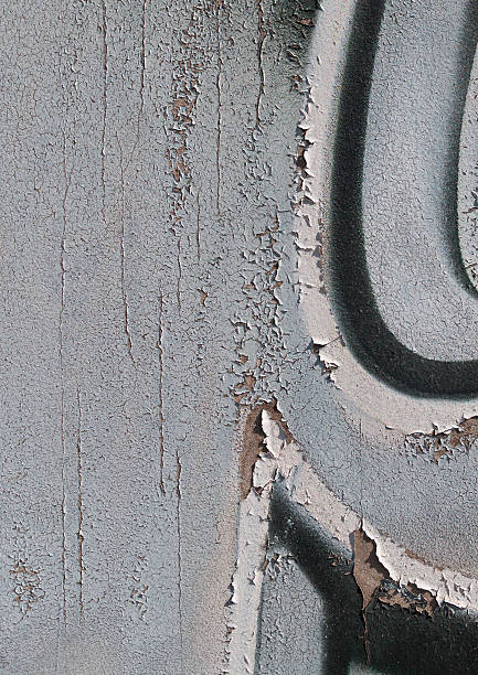 istock Close-up of old peeling paint on a wall surface. 2238912703