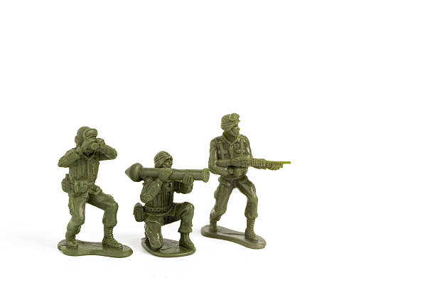 Mini Green Toy Soldiers on white background.
