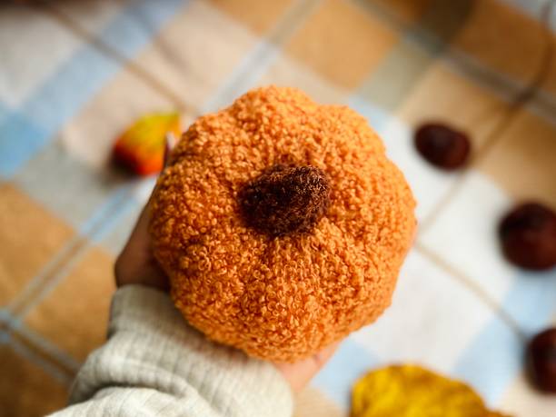 istock plush knitted pumpkin for decoration 2238914672