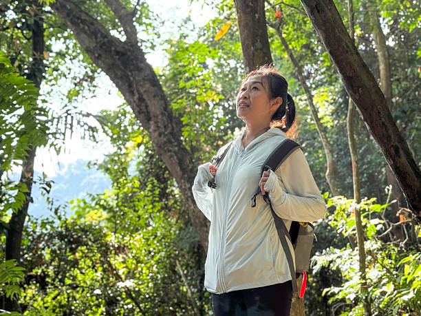 istock Outdoor Adventure: Female Hiker on Rainforest Trail 2238920051