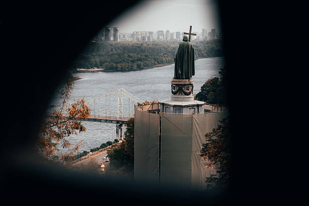 istock Historic Statue Under Restoration Overlooking City River and Skyline 2238920163