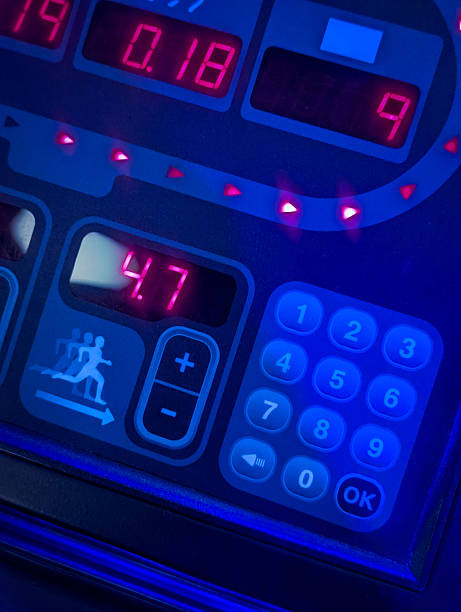 istock sports treadmill dashboard with bright red numbers and keypad 2238920390