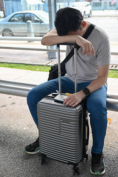 istock Corporate Man Resting with Headache at Railway Platform 2238920948