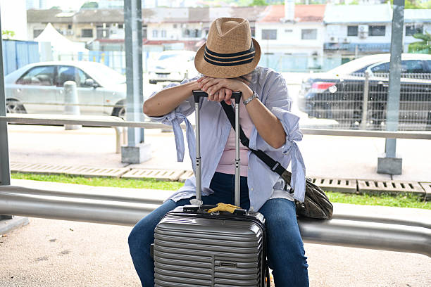 istock Canceled Journey: Woman Takes a Moment to Regain Composure 2238921398