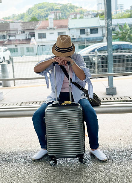 istock Travel Crisis: Woman Waiting Patiently After Flight Cancellation 2238921596