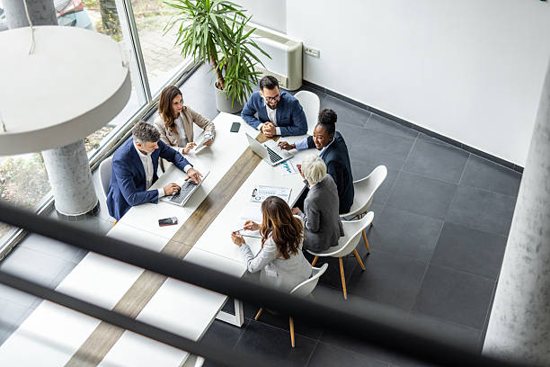 istock Business professionals collaborating at modern office meeting 2238923486