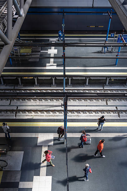 Príncipe pío metro and train station. Madrid. Spain. People on a metro station platform, waiting for a train and walking to their destinations. Public transport concept