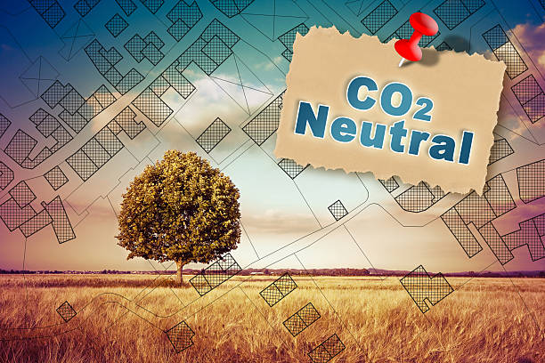 istock CO2 Neutral in construction industry and building activity with home against a natural landscape with lone tree and imaginary city map 2238929335