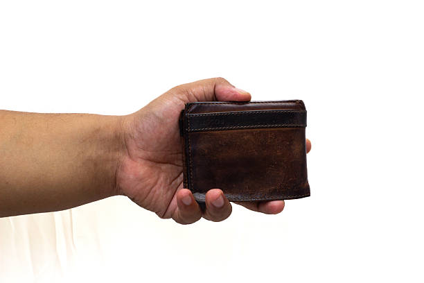 istock Person holding brown leather wallet showcasing style and texture against a white backdrop 2238930755