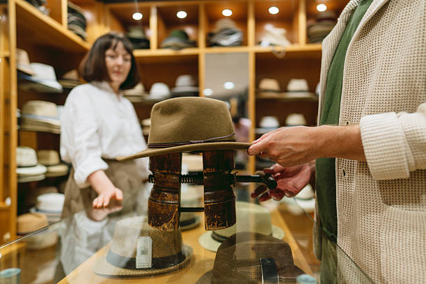 Photo of a craftsman changing the size of a hat in his Hat shop