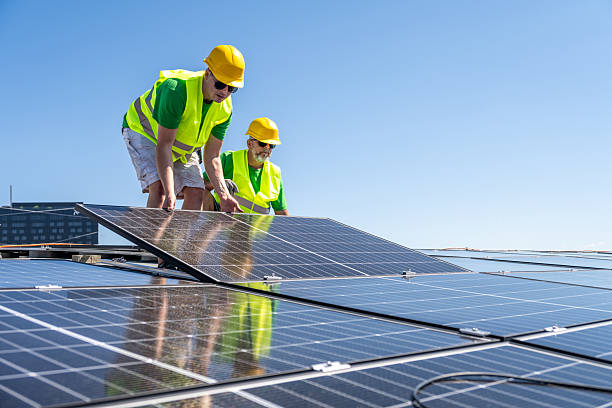 istock Workers Installing Solar Panels with Safety Gear 2238937684