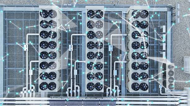 High-tech data center rooftop with ventilators and digital graphics overlay representing network connectivity stock photo