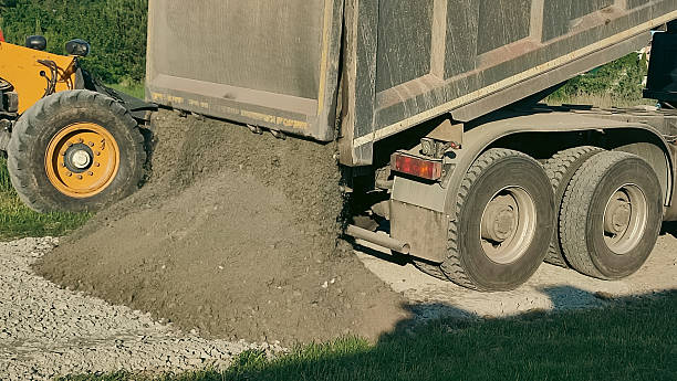 istock Road Construction. Grader grading gravel for road. New road under construction 2238941378