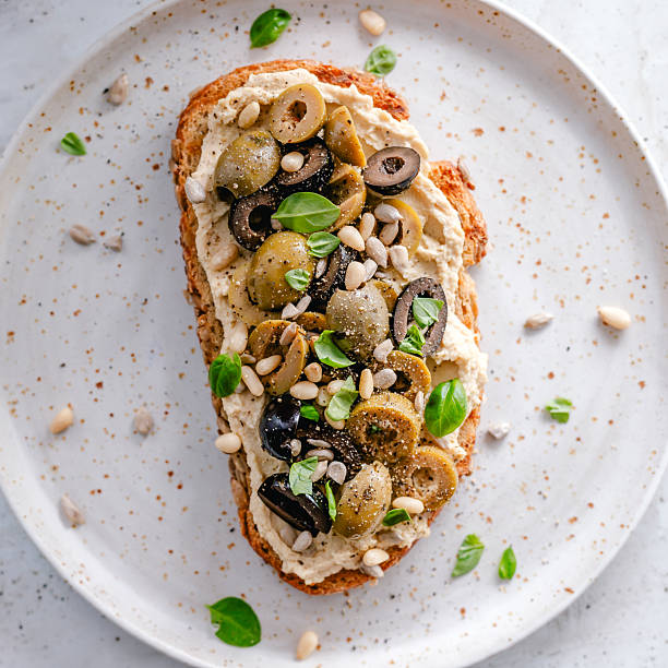 Hummus and olives toast
