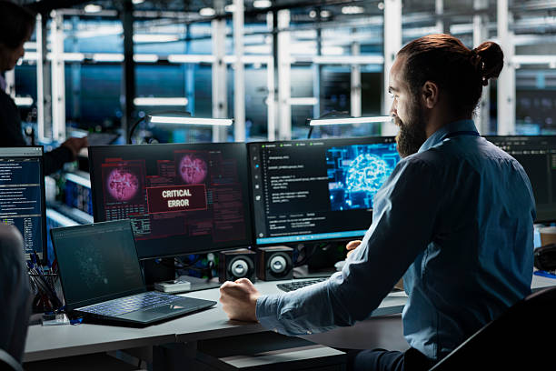 istock Frustrated data center system administrator at desk upset by malfunctioning gear 2238948155