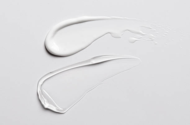 istock A sample of white and transparent cosmetic cream 2238952544