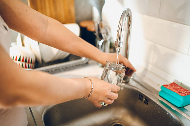 istock Woman washes the dishes 2238952910