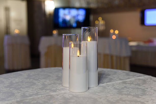 istock Three burning candles on the table. Candlelight in the room. 2238954572