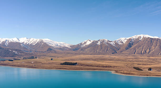 istock Snowcapped Mountains And Lake Tekapo 2238955232