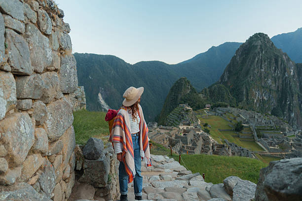 istock Woman exploring Machu Picchu during trip to Peru 2238955318