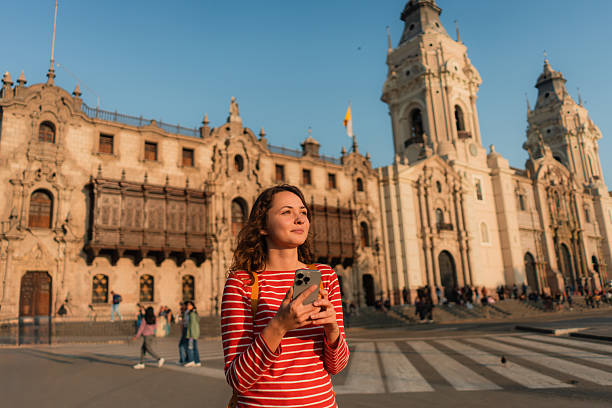 istock Woman using smartphone walking in Lima, Peru 2238956138