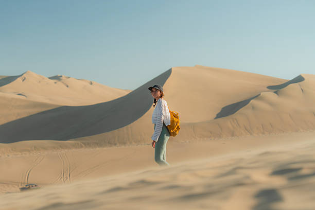 istock Adventurous woman exploring desert oasis in Peru 2238959285