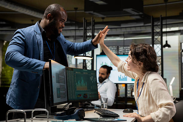 istock Happy colleagues sharing a high five after successful tasks accomplishment 2238959439