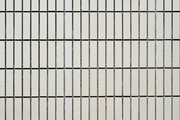 istock Texture of white exterior wall tiles. 2238960425