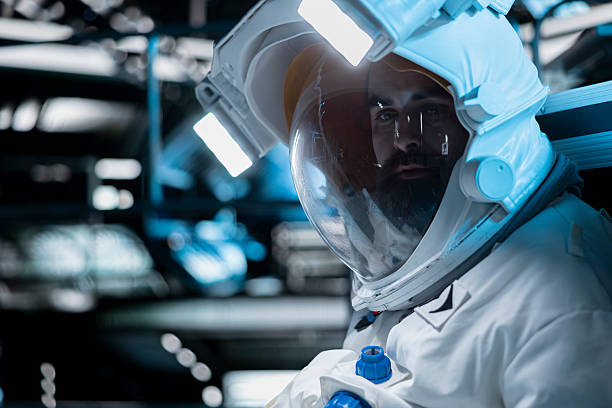 Astronaut in orange suit lands on a hostile planet.
