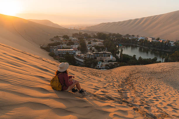 istock Woman exploring desert oasis in Peru at sunrise 2238961149