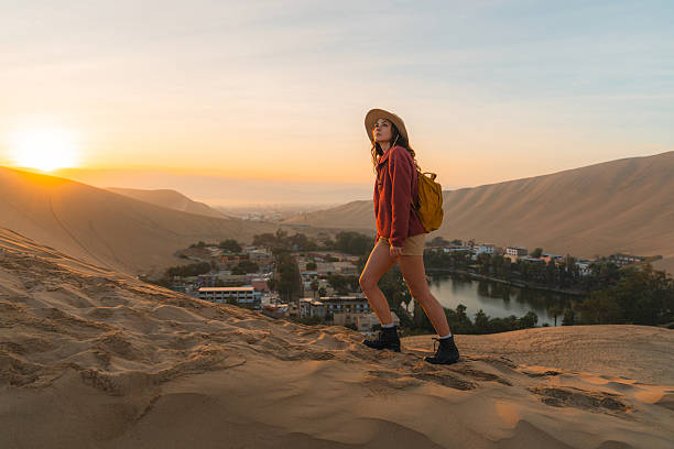 istock Woman exploring desert oasis in Peru at sunrise 2238961150