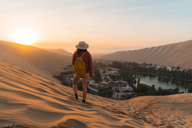 istock Woman exploring desert oasis in Peru at sunrise 2238961495