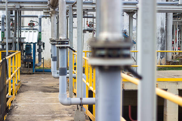 istock Industrial scene showcasing pipes and yellow railings in a processing plant environment 2238964803