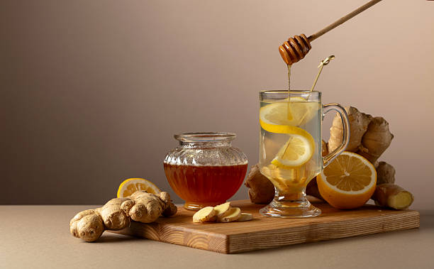 istock Ginger tea with lemon and honey on a beige background. 2238968284