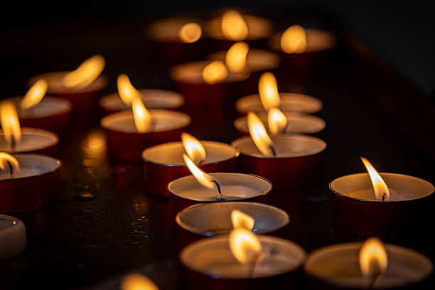 istock Lit tea lights in a religious building, with a shallow depth of field 2238972426